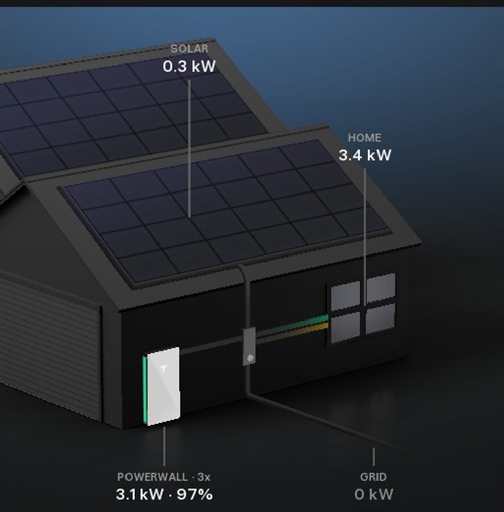 Technician installing a Tesla Powerwall battery system